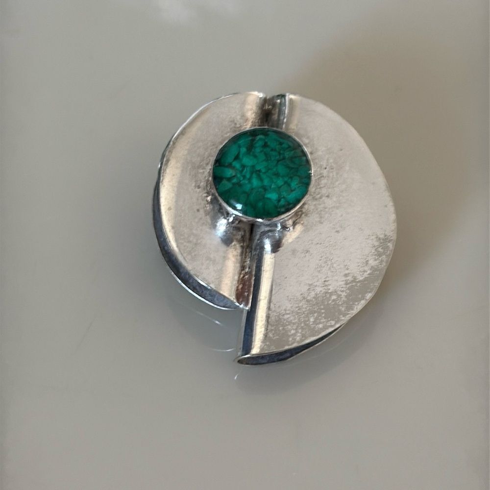 MCM sterling silver pin